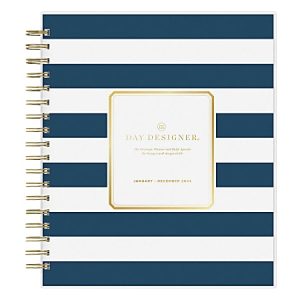 Blue and white striped Day Designer planner for January to December 2024 with gold accents and spiral binding.