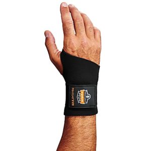 Hand wearing a black protective wrist support with a branded patch.