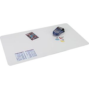 White desk mat with printed schedules, a calculator, three plastic arrows, and a photo of people.