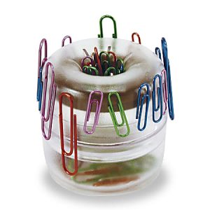 Transparent round paper clip holder with various colored paper clips attached to the outer edge and stored inside.