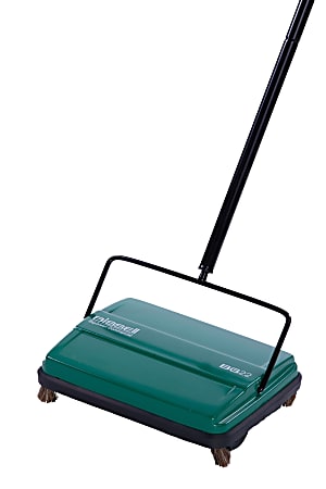 Green manual carpet sweeper with four wheels and a long handle, designed for quick and efficient floor cleaning.