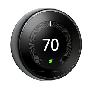 Smart thermostat displaying 70 degrees with an energy-saving leaf icon on a sleek circular screen.