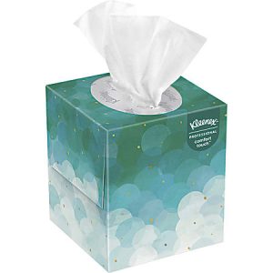 A green Kleenex tissue box with a circular floral pattern and tissues protruding from the top.