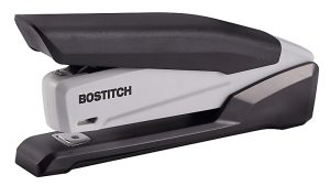 Black and gray Bostitch stapler, side view, isolated on white background.