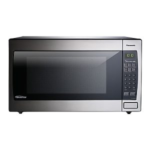 Stainless steel microwave oven with digital display and keypad, featuring inverter technology for consistent cooking.