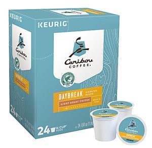 Caribou Coffee Daybreak K-Cup box with 24 pods, light roast, featuring a teal and white design with logos.