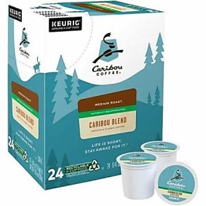 Caribou Coffee box with 24 medium roast, decaf K-Cups. Green and brown design with trees and Caribou logo.