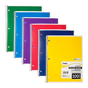 Six spiral-bound notebooks in green, blue, purple, red, black, and yellow with college-ruled pages, arranged in a fan shape.
