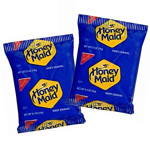 Two blue Honey Maid Honey Grahams snack packs, each weighing 0.5 oz, with yellow logos and red seals.