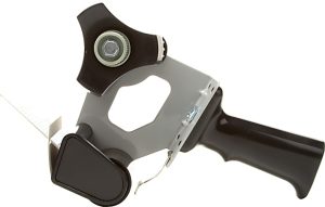 Manual tape dispenser with a black handle and gray metal frame, featuring a circular cutting blade attachment.