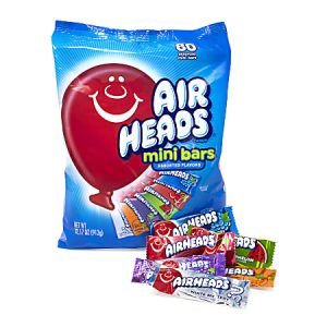 Bag of Airheads mini bars, assorted flavors, with some bars displayed in front.