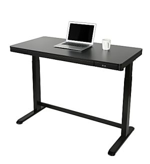 Black adjustable standing desk with a laptop and a white mug placed on top.