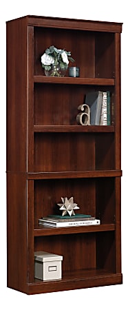 Tall wooden bookshelf with five shelves, displaying books, a small plant, decorative items, and a storage box.