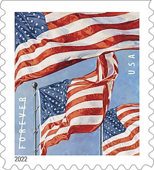 U.S. postage stamp featuring three U.S. flags waving against a blue sky, labeled "Forever USA," issued in 2022.