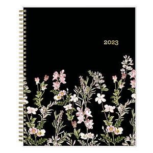 2023 spiral-bound planner with a black cover and floral design featuring pink and white flowers.