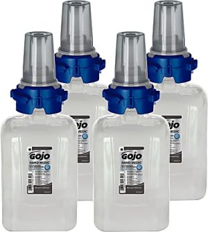 Four Gojo Hand Medic bottles with blue caps and clear dispenser tops, arranged in two rows.