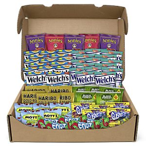 Box of assorted fruit snacks including Annie's, Welch's, Haribo, Black Forest, Mott's, and Gushers, neatly packed.