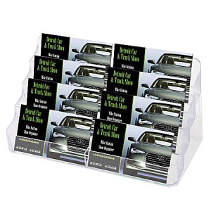 Display rack with Detroit Car & Truck Show brochures featuring a car image, stacked neatly in three rows.