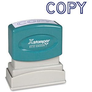 Green and white "Xstamper Eco-Green" stamp labeled with "COPY" next to a blue "COPY" imprint on a white background.