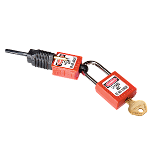 Red safety padlock with a key inserted, bearing warning labels and a black locking mechanism attached.